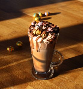 creme egg hot chocolate in glass mug