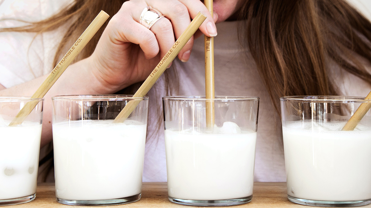 woman drinking oat milk
