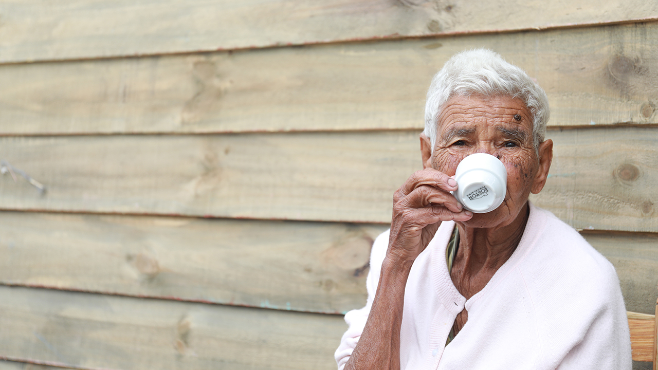 old woman drinking coffee