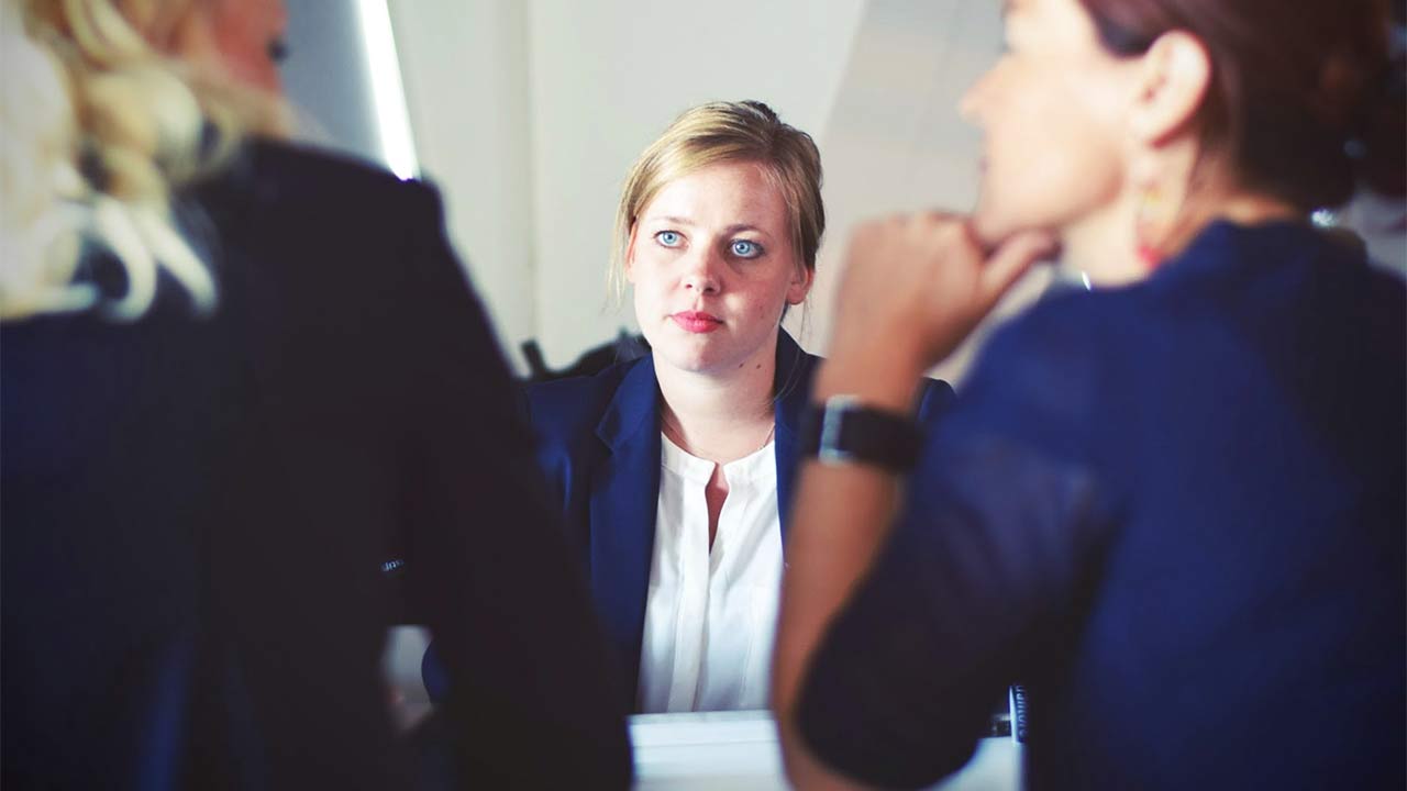 pensive woman in a business meeting