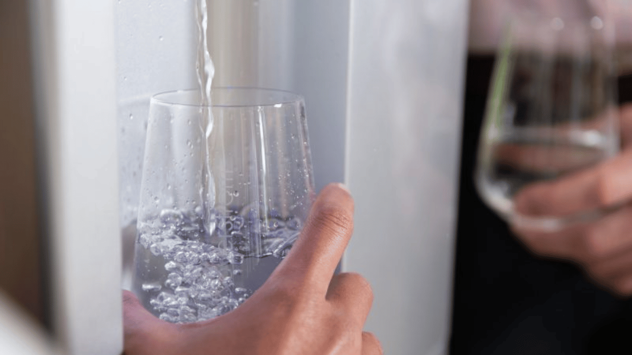 Pouring water in a glass]