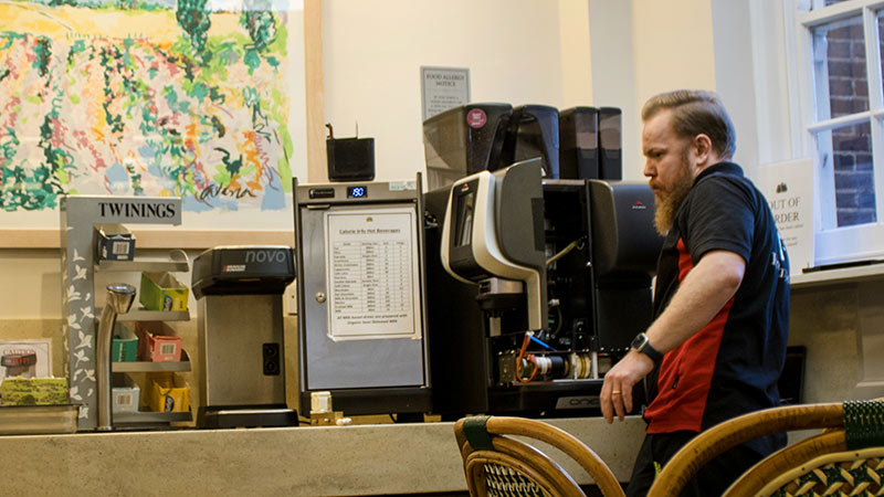 Technician with coffee machine